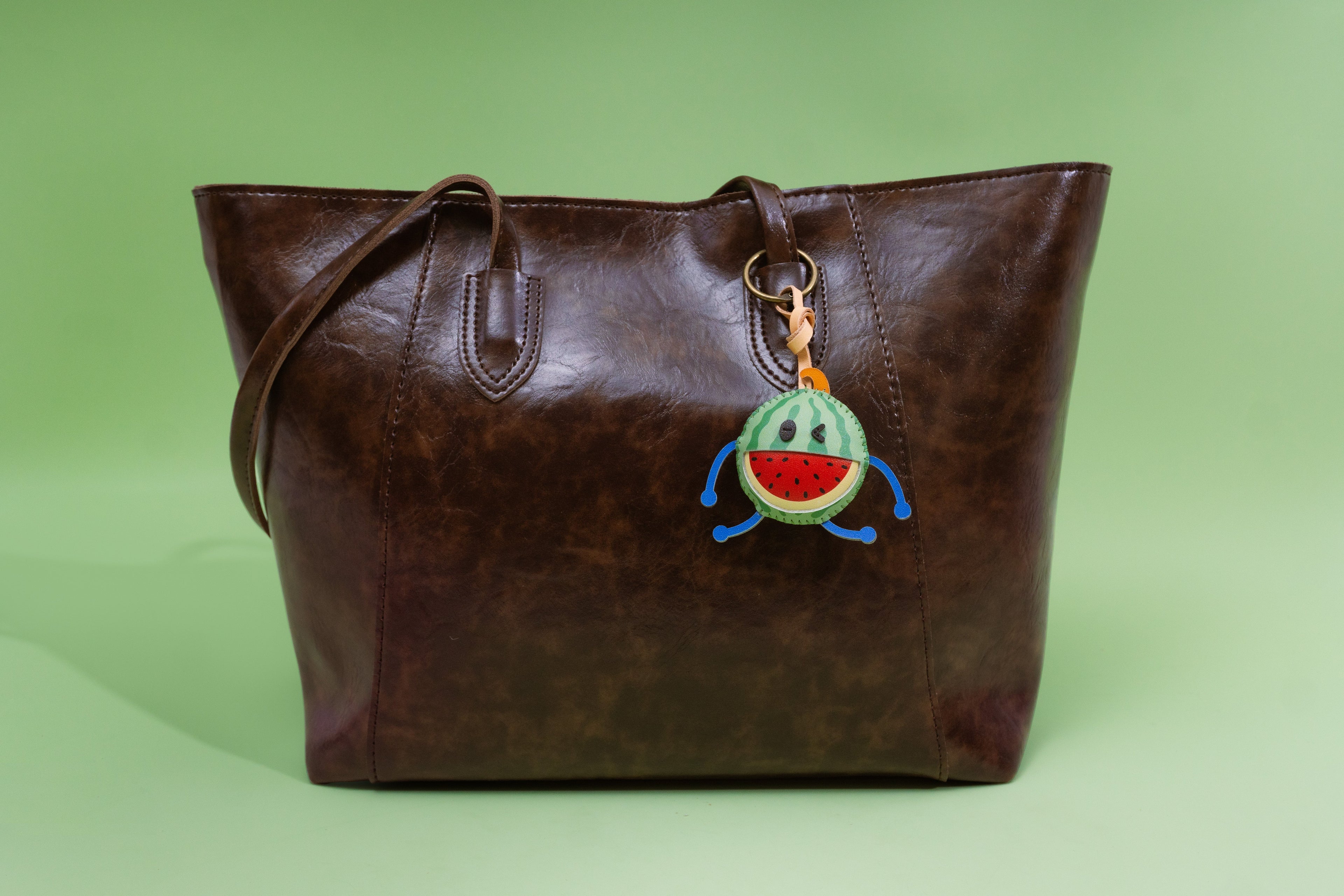 How to style luxury bag charms with every trendy bag material